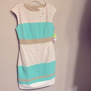 This is a beige tan and teal dress. Ideal for spring.
